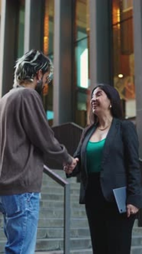 Business Handshake Outside Modern Building