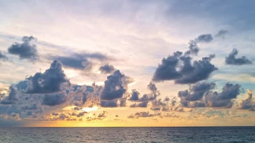 Sunset with Sun and Clouds on Blue and Orange Dramatic Sky with Sun Rays Night Sunset Sky Timelapse
