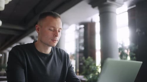 Portrait Of Male Freelancer Using Laptop In Cafe Man With Portable Computer Online Job