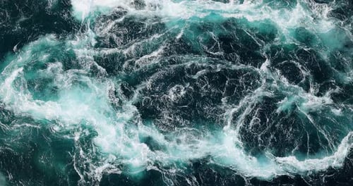 Blue waves of water of the river and the sea meet each other during high tide and low tide.