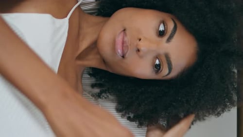 Attractive Woman Relaxes in Bed