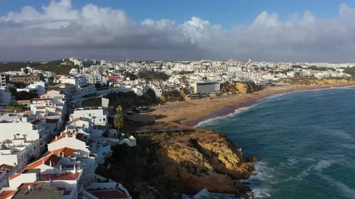 Aerial view of seaside Albufeira with wide beach and white architecture, Algarve, Portugal. Wide san