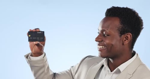 Happy black man, credit card and finance for banking or advertising against a blue studio