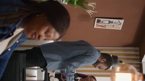 Hotel Guest Checking In at Reception Desk