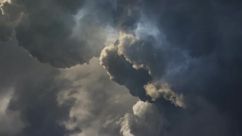 The sun's rays were covered in thick, dark cumulonimbus clouds with thunderstorms inside.