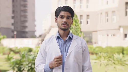 Young Doctor Explains a Medical Topic Outdoors