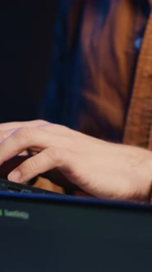 Programmer Concentrating on Writing Binary Code Scripts on Laptop Close Up