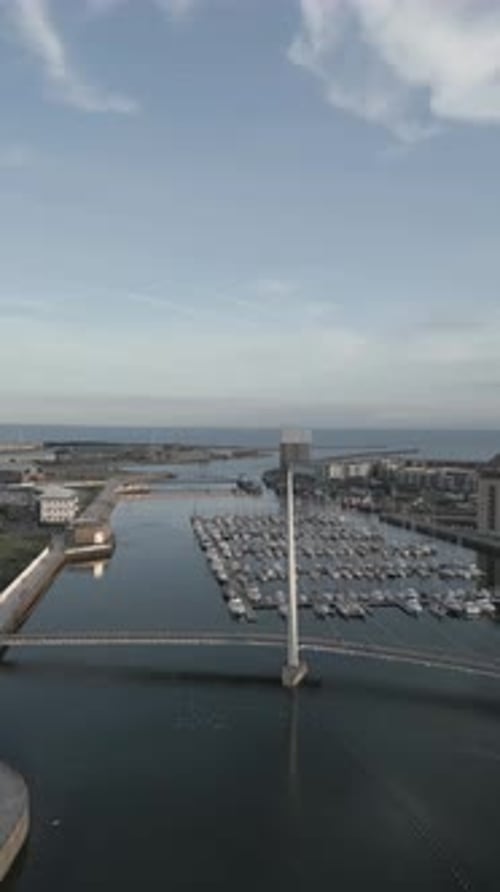 Aerial video of Swansea Marina and Millennium bridge, Maritime Quarter, Swansea, South Wales