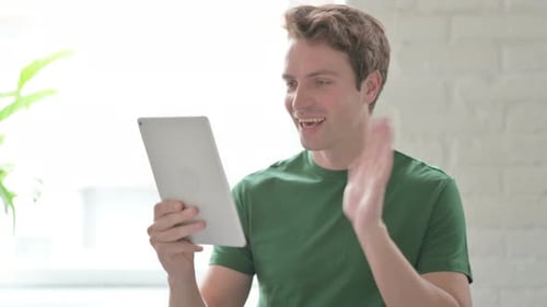 Young Adult Using Tablet for Video Call