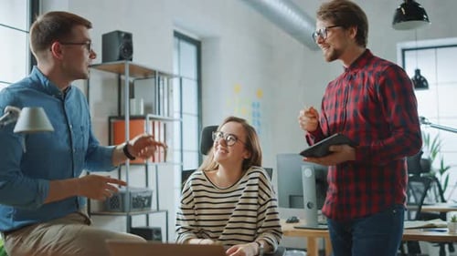 Team Discussing Business in Bright Modern Office