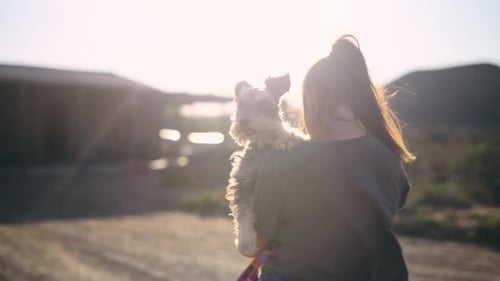 Back, pet and a woman walking with her dog on a farm in the countryside for freedom or adventure