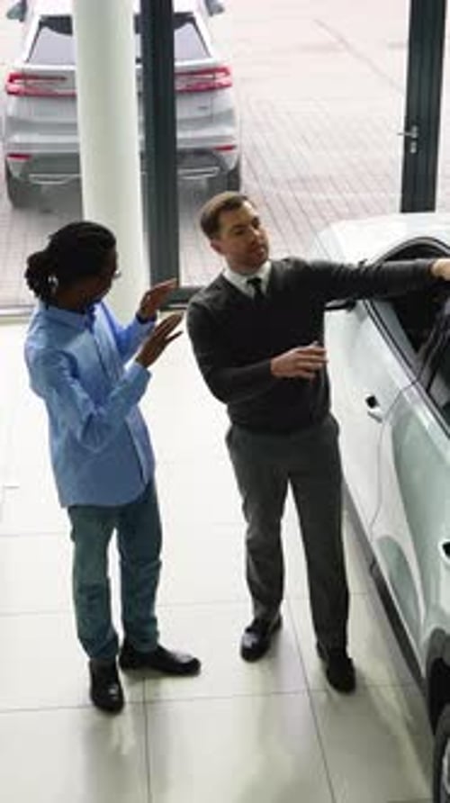 Man Buying a Car at a Dealership