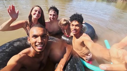 Selfie, swimming and friends in lake in nature on holiday, summer vacation and weekend