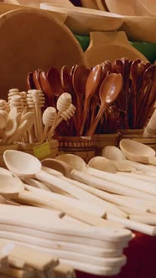 Vertical video Wooden kitchenware displayed at a craft fair