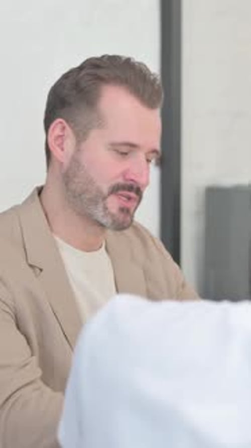 Close up of Young Business People Talking in Office, vertical video