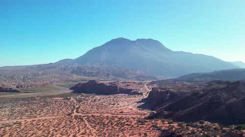 Aerial view drone flying over scenic rocky mountains and arid desert