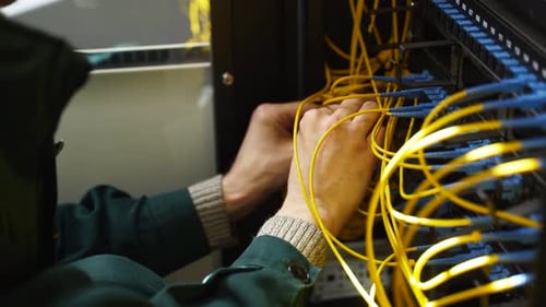 Worker Connects Optical Line Internet Wire in Connection Box Service Man Soldering Optical Fiber
