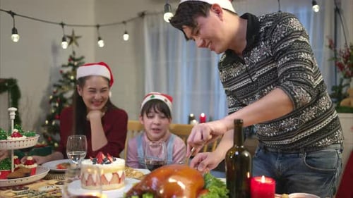 Family Carving Roast Bird for Christmas Dinner