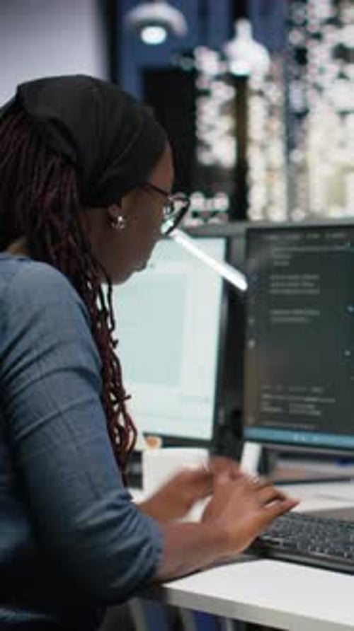 Vertical Video Panicked Female Engineer in Office Requests Help From Colleagues to Block Hacker