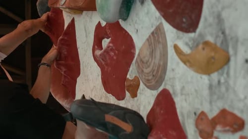 Man Climbing Indoor Rock Climbing Wall Close Up