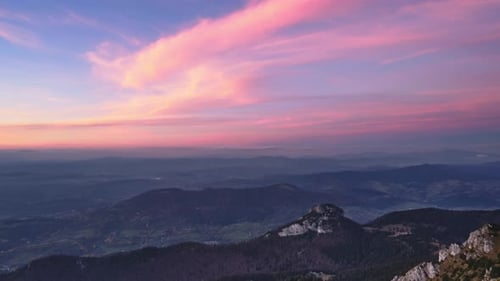 Warm Colors of Clouds at Dusk in a Rocky Forest Mountain Landscape