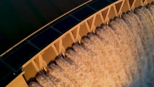 Aerial drone view of reservoir spillway - large volumes of water - 4K - 30fps
