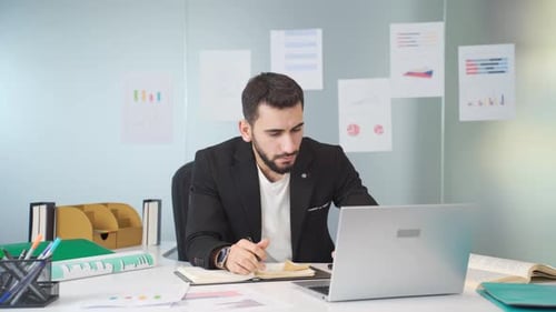 Young businessman works in his office.