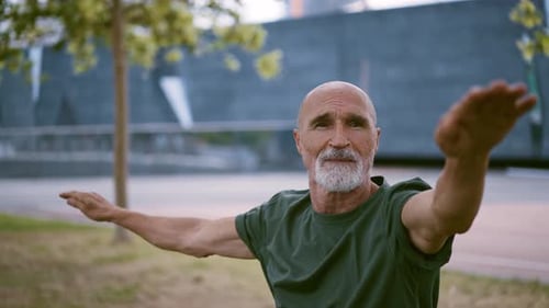 Senior Man Doing Yoga Balance Exercise Outdoors