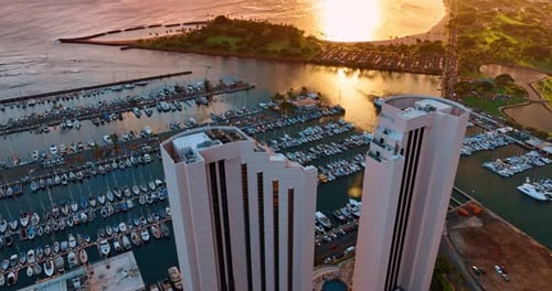 Two similar beautiful buildings on the shore of Waikiki, Honolulu, Hawaii, USA.