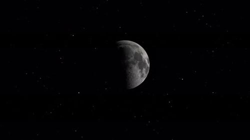 Majestic View of the Waning Moon Against the Starfilled Night Sky Showcasing Celestial Beauty