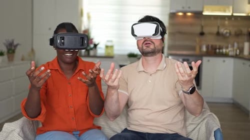 Couple enjoys virtual reality experience in their home