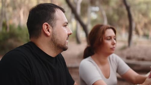 Couple Talking and Resting in a Park