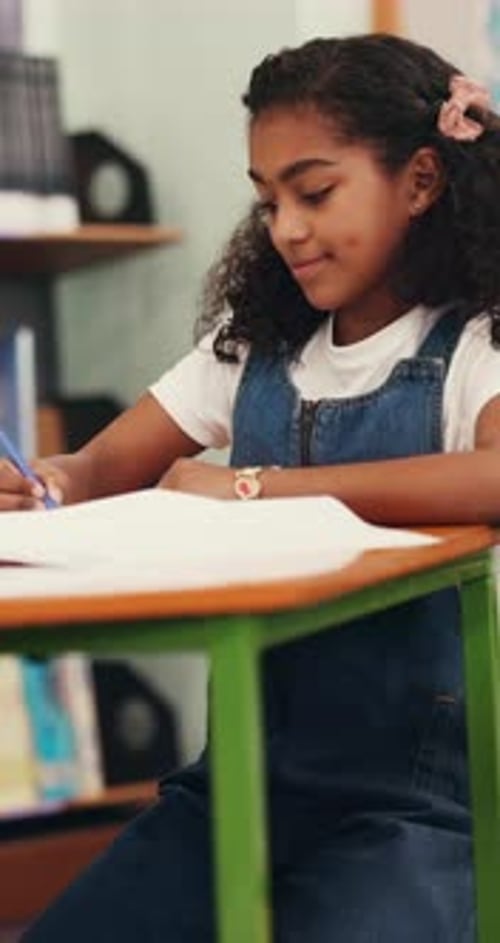 Girl, student and writing with book in library for homework, education or learning in school