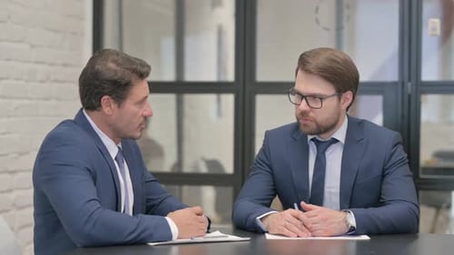 Serious Business Meeting in Modern Office