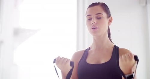 Fitness, gym and woman with resistance band for training, strength or bodybuilding workout