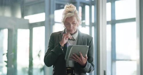 Think, reading and business woman with tablet in office for financial review, research or decision