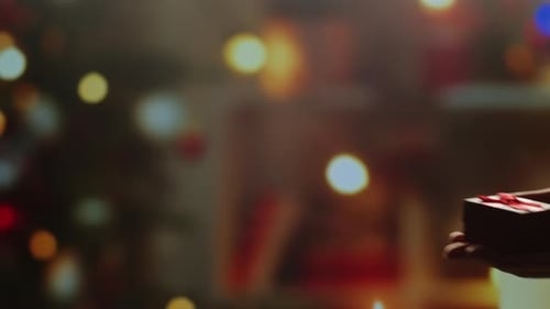 Giving Red Holiday Gift to a Loved One