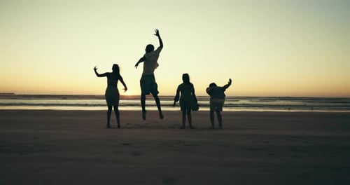 Jumping, friends and people on beach at sunset for holiday, vacation and adventure together