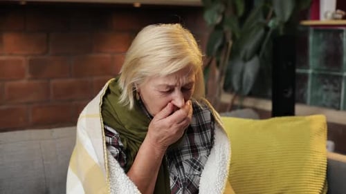 Lonely Ill Woman Aged Looking at Camera Coughing Nice Unhappy Woman with Court Blonde Hair Sitting