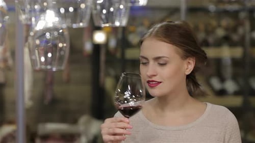 Woman Enjoys Glass of Red Wine