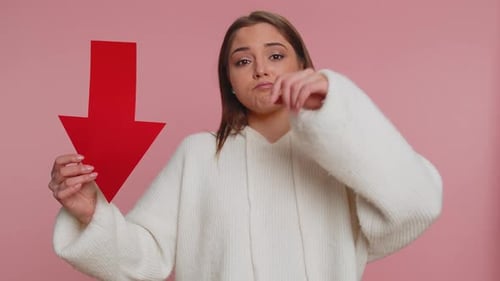 Upset Young Woman Showing Red Arrow Pointing Down Concept of Downgrade Bankruptcy Money Fail Fall