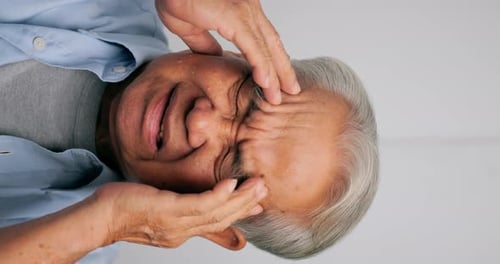Senior Man Massaging Temples Relieving Headache