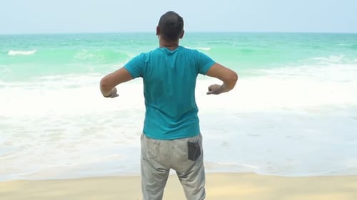Sporty Man Stretching Arms and Admire View on Beach Super