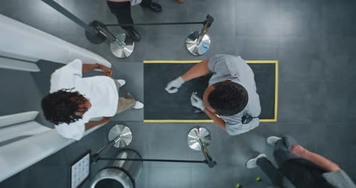 Diverse People Passing Through Xray Metal Detector Scanner Airport Worker Checking Passengers
