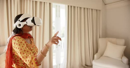 Woman Using VR Headset in Bright Home