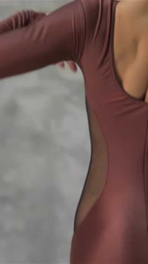 Woman Model Posing in Brown Bodysuit in Studio