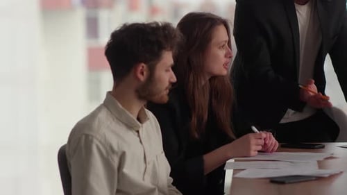 Team Discussing Business in a Modern Office