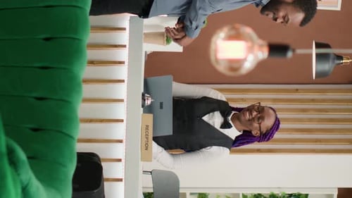 Vertical Video Tourist Registering at Luxury Hotel