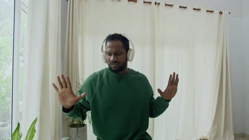 Man Dancing to Music at Home