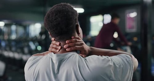 Back, man and discomfort with neck pain at gym from fitness injury, muscle strain and ache